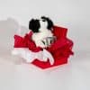 Valentine gift box with plush puppy and love mug in red and white romantic packaging on neutral background