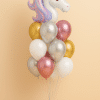 Balloon bouquet with a large foil unicorn head balloon and a mix of white, gold, silver, and pink latex balloons on a pastel blue base.