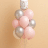 Balloon bouquet with a pink and white baby bottle-shaped foil balloon reading “Baby Girl,” surrounded by pink, silver, and white latex balloons on a pastel balloon base.