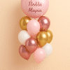 Balloon bouquet featuring a blush pink foil balloon with personal message and a mix of gold, rose gold, pink, and white latex balloons arranged on a mini balloon base.