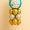 Balloon bouquet featuring a large turquoise “Sweet Baby Boy” foil balloon with gold accents, surrounded by metallic gold and silver latex balloons, and finished with a matching mini balloon base.