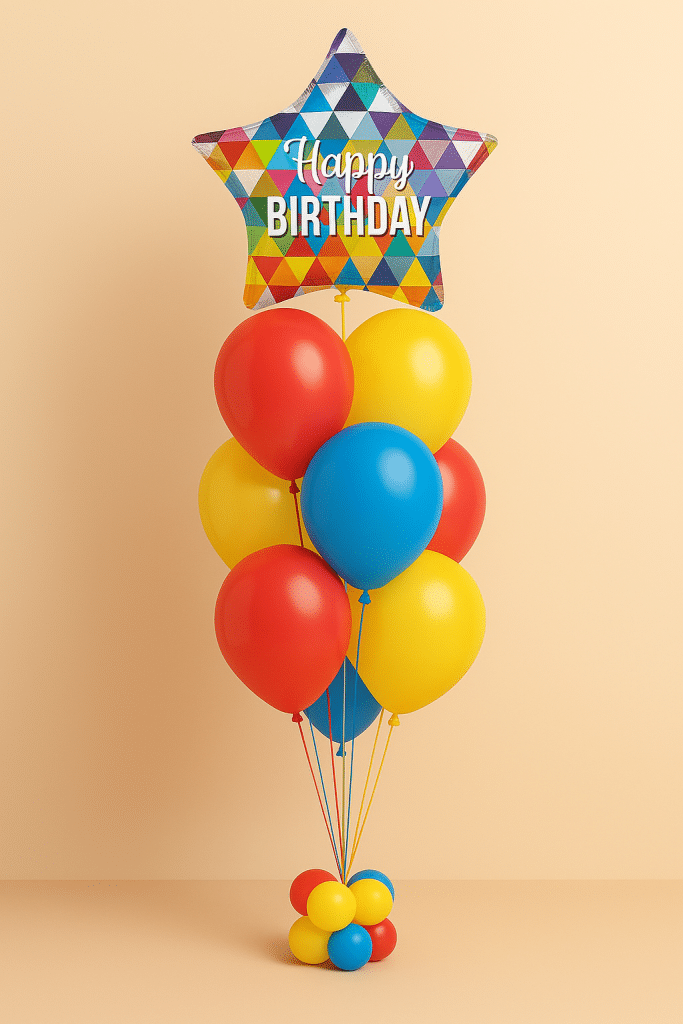 Balloon bouquet with colorful star-shaped foil balloon that reads “Happy Birthday” with a mix of red, yellow, and blue latex balloons on a matching balloon base.