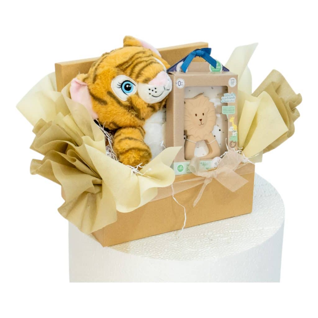Luxury lion-themed baby gift box with plush tiger and Tikiri lion teether, ready for gifting