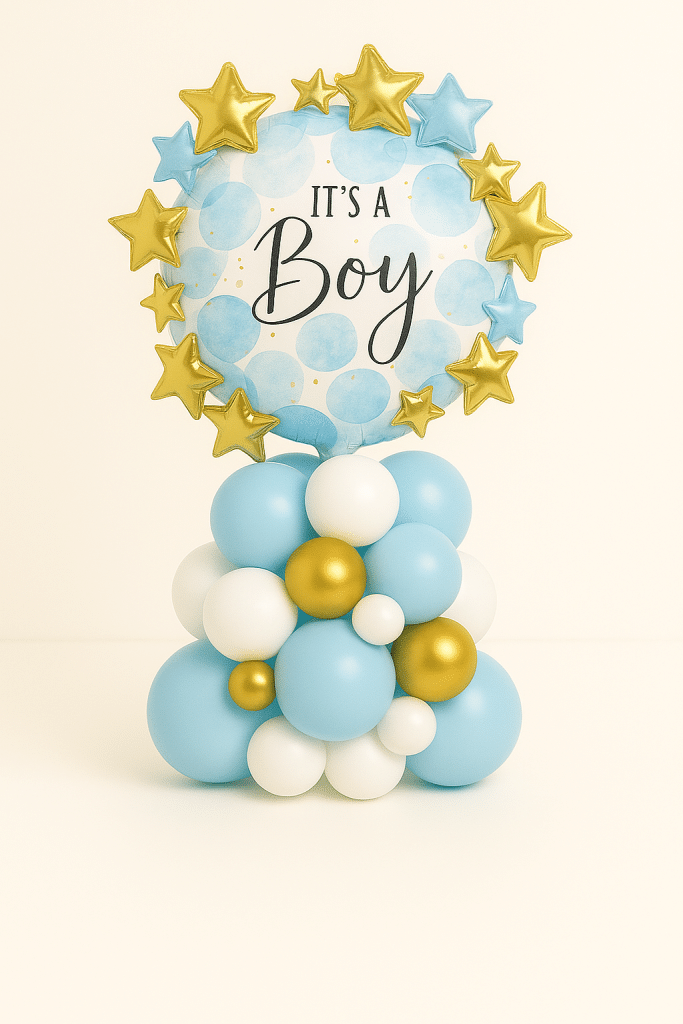 “It’s a Boy” balloon tower featuring a blue and white round foil balloon with golden and blue foil stars, set on a pastel blue, white, and gold latex balloon base — perfect for baby boy celebrations.