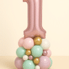 Rose gold number 1 balloon arrangement with a pastel base of mint green, blush pink, ivory, lilac, and metallic gold balloons — perfect for a baby girl’s 1st birthday celebration.