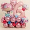 Balloon display with a pink mermaid foil balloon, blush pink number 6, and themed foil balloons, arranged over a metallic rose and pastel balloon base in pink, purple, red, and blue.