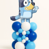 Balloon tower with blue puppy foil balloon on a navy, light blue, and white balloon base