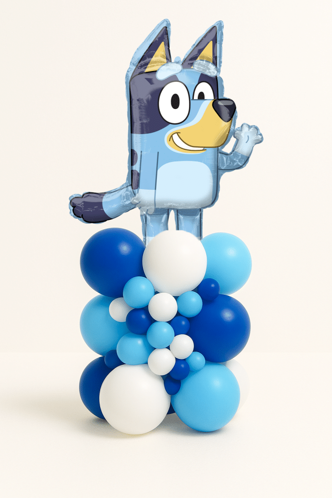 Balloon tower with blue puppy foil balloon on a navy, light blue, and white balloon base