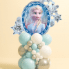 Balloon tower with ice princess foil balloon and clustered latex balloons in icy blue, silver, and white with snowflake design. Frozen