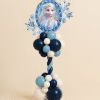 Frozen-themed Elsa balloon tower with foil balloon centerpiece, navy blue, aqua, and white latex balloons in spiral tower with clustered base.