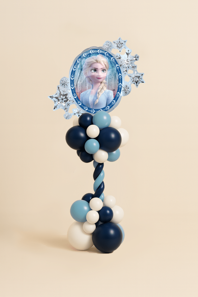 Frozen-themed Elsa balloon tower with foil balloon centerpiece, navy blue, aqua, and white latex balloons in spiral tower with clustered base.