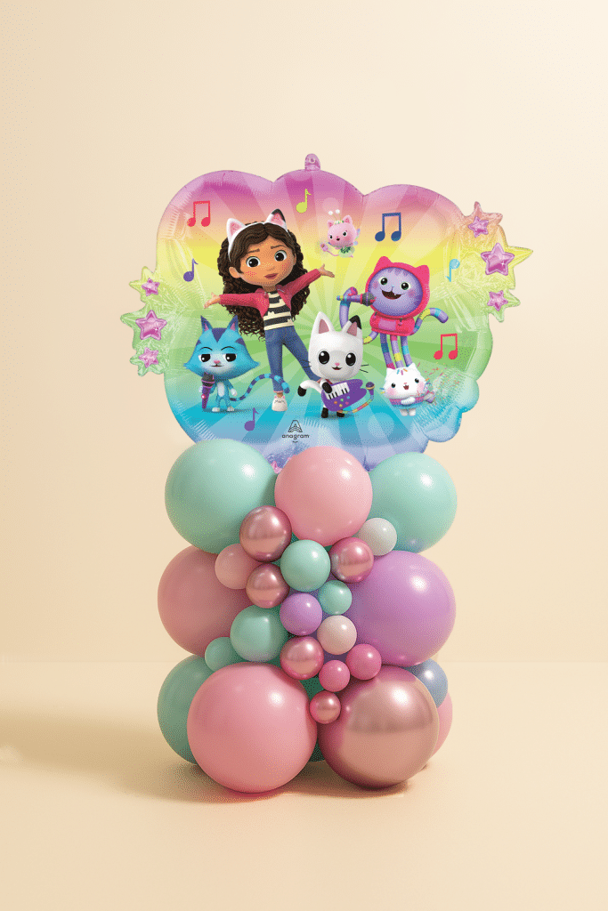 Gabby’s Dollhouse balloon tower with foil balloon featuring Gabby and cats, on a pastel pink, mint, lilac, and rose-gold layered balloon base.