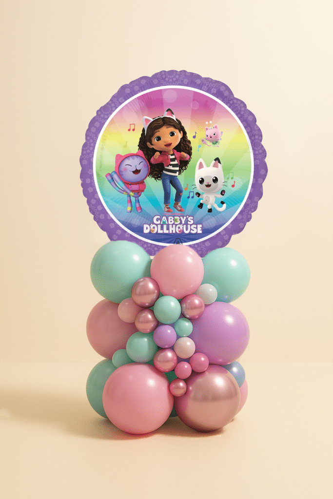 Gabby’s Dollhouse balloon tower with round foil balloon featuring Gabby and cats, on a pastel pink, mint, lilac, and rose-gold balloon base.