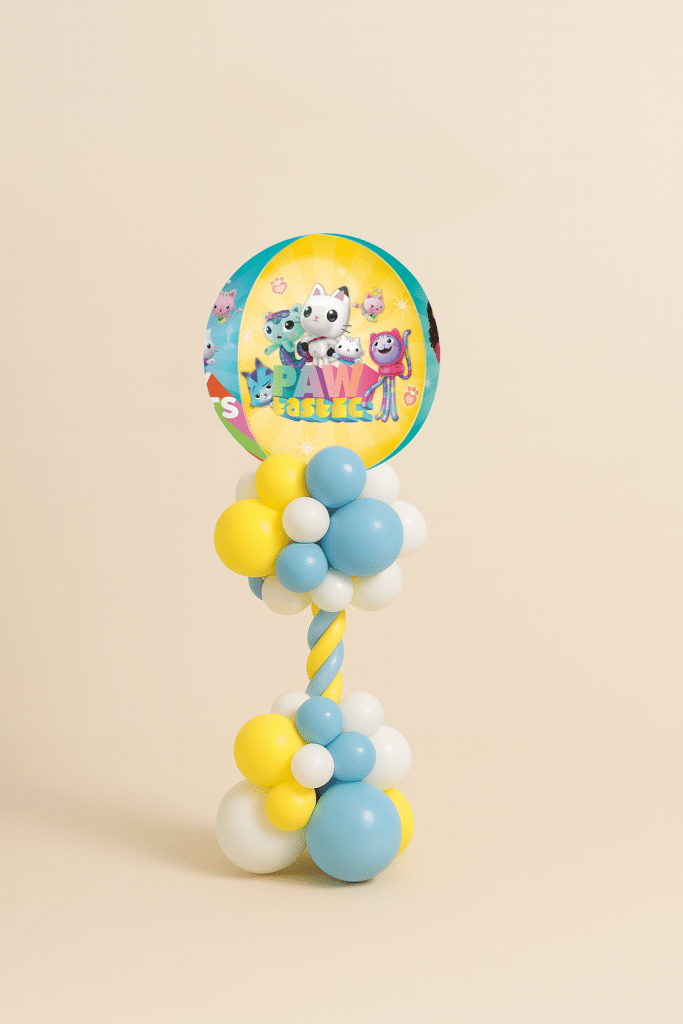 Gabby’s Dollhouse balloon tower with PAW-tastic foil balloon featuring Gabby Cats characters, decorated with a spiral yellow, blue, and white balloon base.