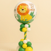 “Jungle-themed balloon column with lion foil balloon topper and green, yellow, and white latex balloons.”