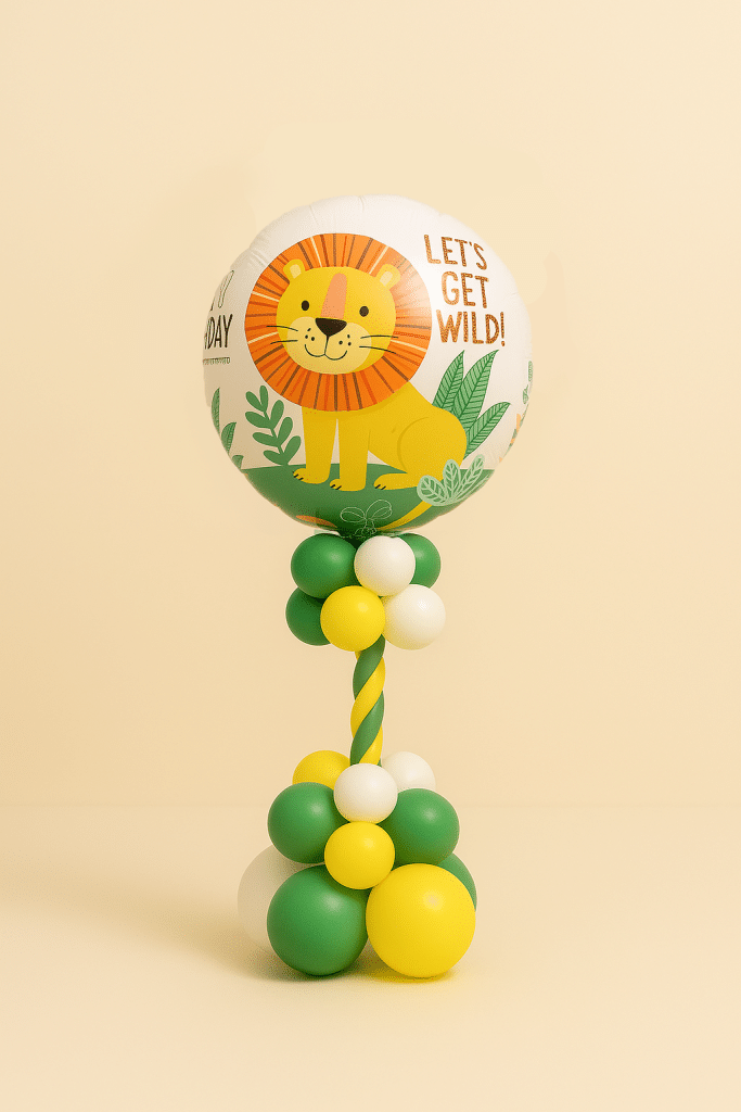 “Jungle-themed balloon column with lion foil balloon topper and green, yellow, and white latex balloons.”