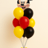 Mickey Mouse head balloon bouquet with red yellow and black latex balloons and matching mini balloon base on neutral background