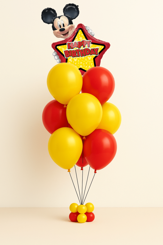 Mickey Mouse Happy Birthday star foil balloon bouquet with red and yellow helium latex balloons and matching mini balloon base on neutral background