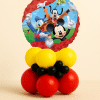 Mickey Mouse Donald Duck and Goofy foil balloon table centerpiece with red, yellow and black latex balloon base on neutral background