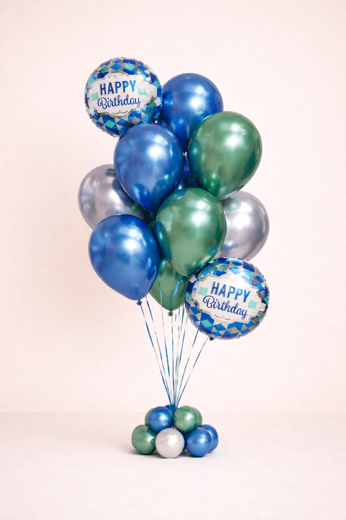 Blue and green chrome birthday balloon bouquet with two Happy Birthday foil balloons and matching mini balloon base