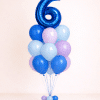 Pastel blue and lavender birthday balloon column with custom foil number balloon and matching floor-standing base
