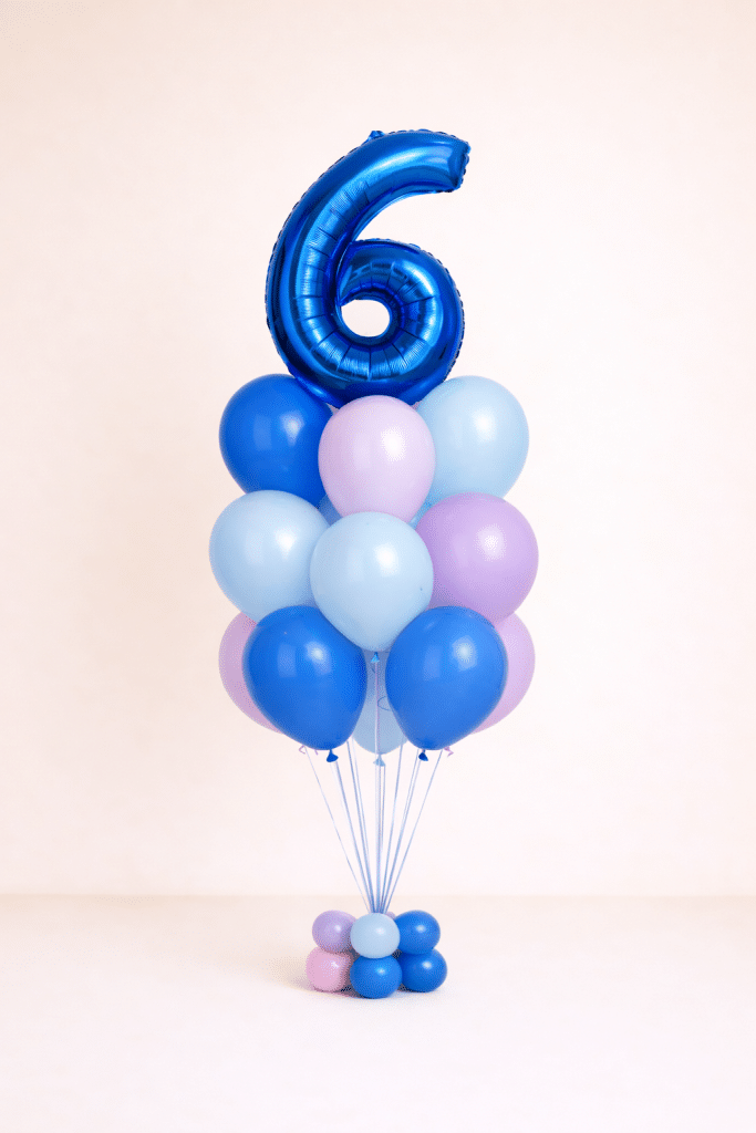 Pastel blue and lavender birthday balloon column with custom foil number balloon and matching floor-standing base