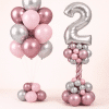 Blush pink and rose gold chrome birthday balloon bouquet with silver number balloon column in elegant metallic tones