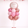 Blush pink and rose gold birthday balloon set with ceiling balloons and matching happy birthday floor bouquet in chrome rose gold tones