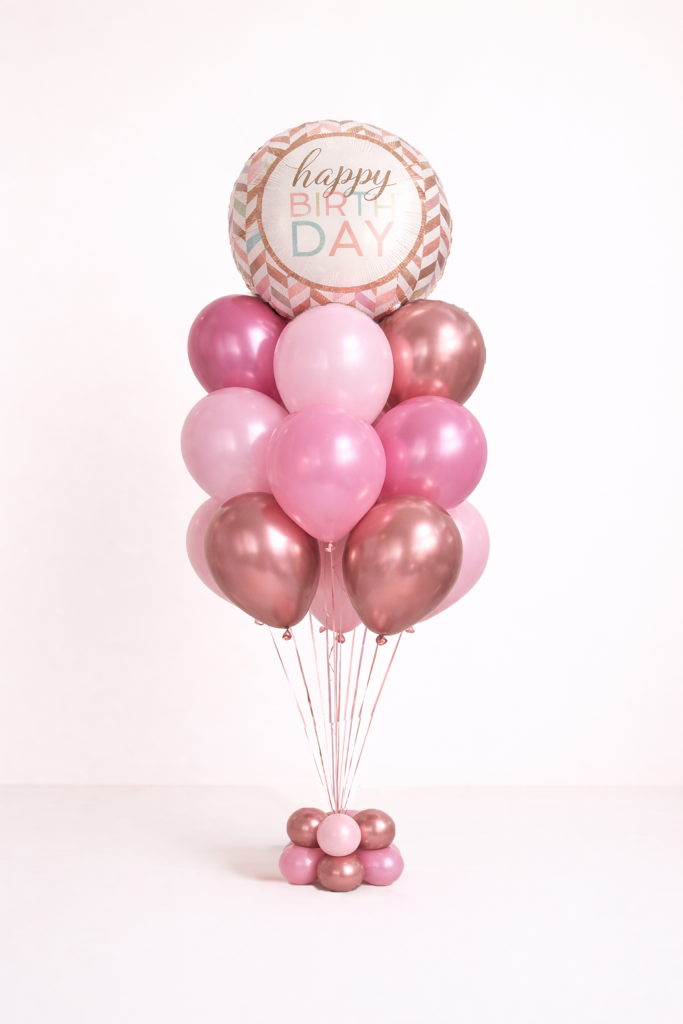 Blush pink and rose gold chrome birthday balloon bouquet with round happy birthday foil and matching floor base arrangement