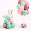 Elegant swan birthday balloon arrangement with mint blush and rose gold latex balloons and matching helium balloon bouquet