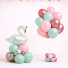 Pastel mint and blush swan balloon arrangement with rose gold helium bouquet and additional loose balloons for elegant event decoration