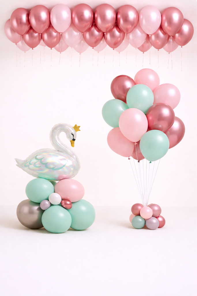 Pastel mint and blush swan balloon arrangement with rose gold helium bouquet and additional loose balloons for elegant event decoration