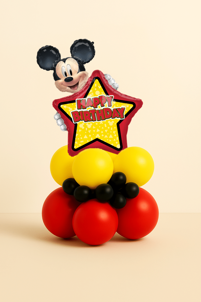 Mickey Mouse Happy Birthday star foil balloon table centerpiece with red yellow and black latex balloon base on neutral background