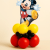Mickey Mouse balloon tower with character foil topper and red, yellow, and black balloon base.