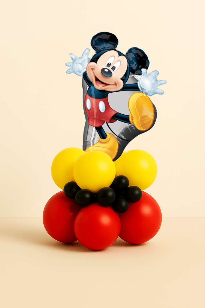 Mickey Mouse balloon tower with character foil topper and red, yellow, and black balloon base.