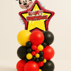 Mickey Mouse Happy Birthday star balloon tower with red yellow and black latex balloon base and decorative mini balloon cluster.