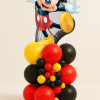 Mickey Mouse character balloon tower with red yellow and black latex balloon base and decorative mini balloon cluster.