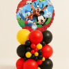 Mickey, Donald and Goofy foil balloon tower with red, yellow and black latex balloon base and decorative mini balloon cluster on a neutral background.