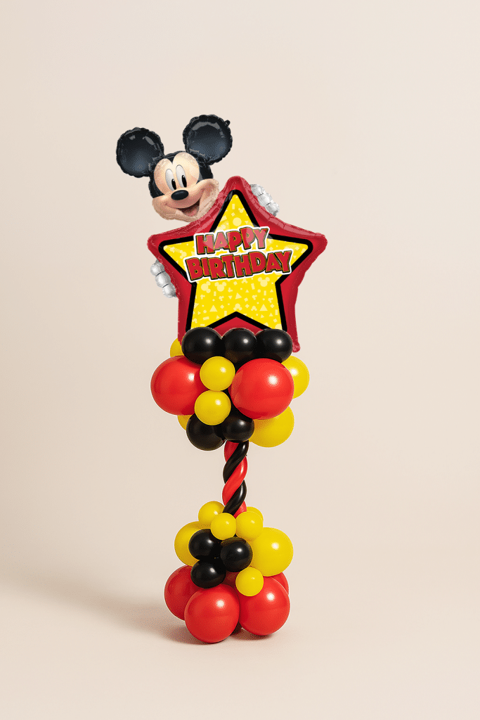 Mickey Happy Birthday star foil balloon tower with red, yellow and black spiral column and matching balloon base on a neutral background.