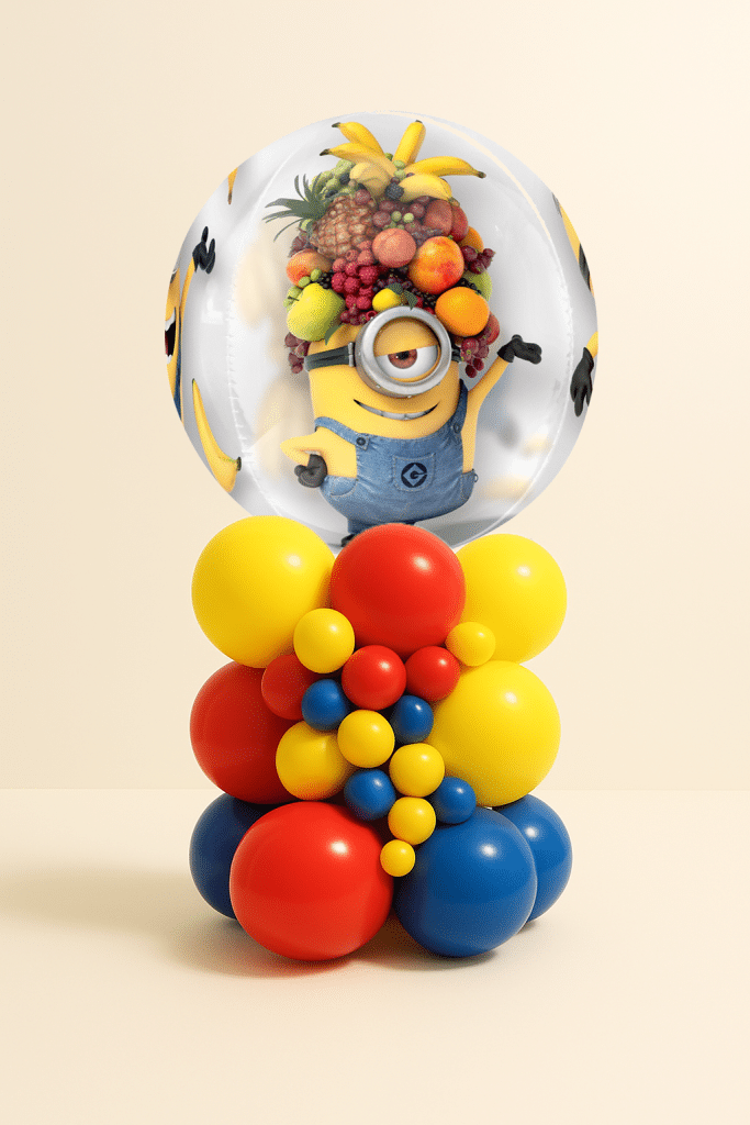 Minions bubble balloon table centerpiece with layered red, yellow and blue latex balloon base on a neutral background.