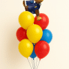 Paw Patrol Chase foil balloon bouquet with red, yellow and blue latex balloons on a matching balloon weight base, displayed on a neutral background.