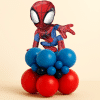 Spider-Man foil balloon mounted on a compact red and blue latex balloon base, designed as a table-size superhero balloon centerpiece on a neutral background.