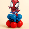 Small Spider-Man foil balloon mounted on a compact red and blue latex balloon base, designed as a superhero table centerpiece on a neutral background.
