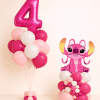 Hot pink and pastel pink Stitch birthday balloon set with helium number bouquet and decorative character balloon base on a neutral background.