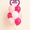 Minnie Mouse Happy Birthday heart foil balloon bouquet with pink and white helium latex balloons on a decorative base against a neutral background.