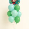 Tropical themed foil balloon on a bouquet of mint green and green latex balloons with a small matching balloon base on a neutral background.