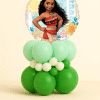 Round Moana foil balloon on a layered green, mint, and ivory latex balloon base on a neutral background.