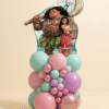 Moana and Maui foil balloon on a pastel mint, pink, lilac, and chrome rose gold organic balloon base on a neutral background.