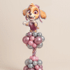 Skye Paw Patrol foil balloon on a pink and chrome silver twisted balloon column with organic balloon clusters on a neutral background
