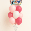 Round Disney Princess foil balloon on a pink and white latex balloon bouquet with small balloon base on a neutral background.